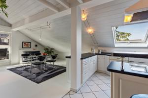 a kitchen and dining room with a table and chairs at Schauerte in Medebach