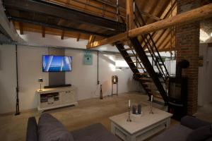 TV a/nebo společenská místnost v ubytování Mini-Loft in schöner Voreifel