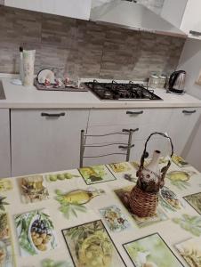 a kitchen with a table with pictures of food on it at Tourist Rental Home ROMA in Rome