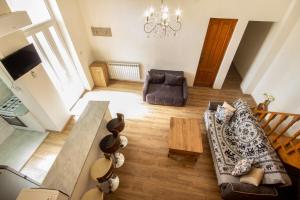 a living room with a couch and a table at Center Apartment 3 Rooms in Tbilisi City