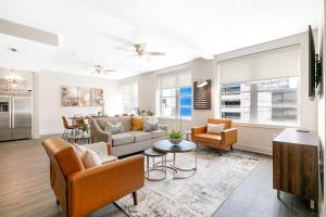 a living room with a couch and a table at Pet-Friendly Spacious condos in Downtown New Orleans in New Orleans