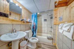 a bathroom with a sink and a toilet and a tub at 8 Private room in heart of Leadville dog friendly in Leadville +58 photos