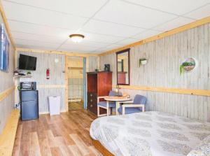a room with a bed and a table in it at 3 Private Room in Motel Dog Friendly Leadville in Leadville