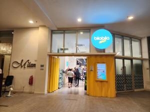 a store entrance with people walking into a store at Regalia Suites Kuala Lumpur KLCC in Kuala Lumpur