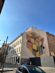 a building with a large painting on the side of it at My little paradise in Budapest +25 photos