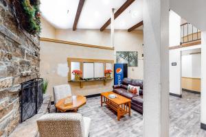 a living room with a couch and a fireplace at Carriage House #215 in Park City