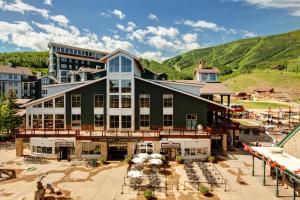 an aerial view of a building with mountains in the background at Carriage House #215 in Park City