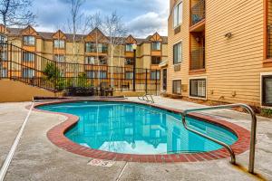 a swimming pool in front of a building at Carriage House #215 in Park City