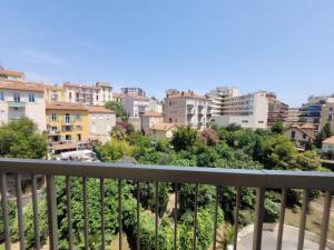 a view of a city from a balcony at Sunny Mercury - Room in Apartment in Cannes