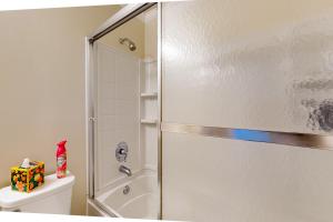 a bathroom with a shower and a toilet at Lazy River, Lazy Days in Shoreline Park +13 photos
