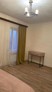 a room with a table and a window at Asatryan’s Guest House in Vagharshapat