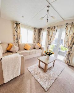 a living room with a couch and a table at Bude 13 in Cubert +33 photos
