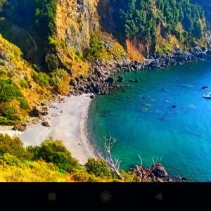 a view of a beach next to the ocean at CASA CELESTE in San Nicola Arcella