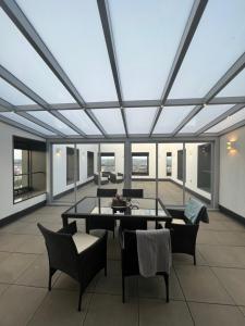 a living room with a large glass ceiling at AZ Tower Apartment in Brno