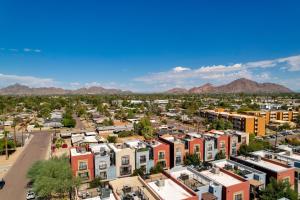an aerial view of a city with buildings and mountains at Rooftop Patio, Skyline Views Phoenix Townhome! in Phoenix