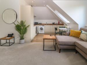 a living room with a couch and a table at Apartment 16 in Y Felinheli