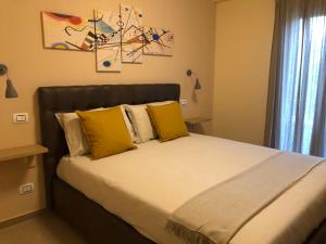 Ένα ή περισσότερα κρεβάτια σε δωμάτιο στο B&B La Margherita