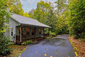 a small house with a porch and a driveway at Laurel Creek in Helen