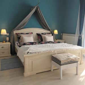 a bedroom with a large bed with a canopy at Villa Wolf Castle - vanjski grijani bazen in Lopatinec +40 photos