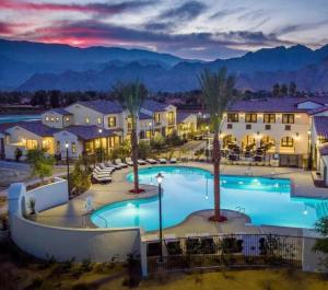 an image of a pool at a resort at night at BRAND NEW La Quinta Home in Signature at PGA West in La Quinta