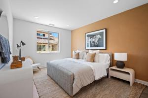 a bedroom with a large bed and a couch at BRAND NEW La Quinta Home in Signature at PGA West in La Quinta +37 photos