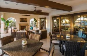 a restaurant with tables and chairs and a couch at BRAND NEW La Quinta Home in Signature at PGA West in La Quinta