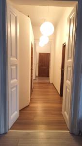 a hallway of an empty room with a light fixture at Urban Nest Apartments Gertrudy 7 in Krakow