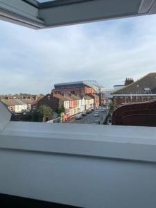 a view of a city street from a balcony at The Glenbuck Hotel Anfield in Liverpool