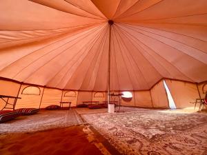 a large tent with a large ceiling at Desert Stars Camp in Bidiyah