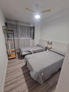 Cama o camas de una habitación en Evangelista59
