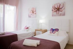 En eller flere senge i et værelse på Estella by Vive La Exclusividad