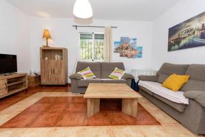 a living room with a couch and a coffee table at Casa Jurinea Alzar in Torres