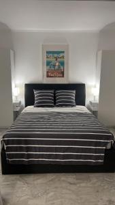 Posteľ alebo postele v izbe v ubytovaní Seafront - beautiful flat with aircon and comfortable loggia