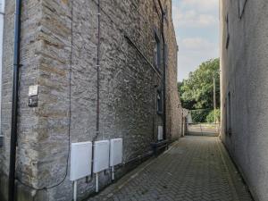 an alley in an old brick building at Flat 2 Englehurst Mews in Buxton