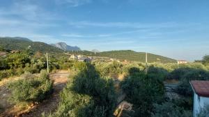 a view of a village with mountains in the background at Seron Mountain House in Geyikbayırı