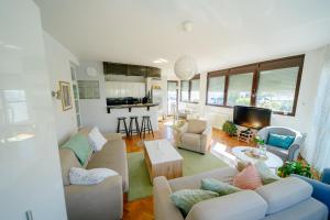 a living room with two couches and a table at MiRa in Užice