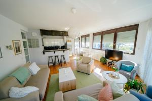 a living room with a couch and a table at MiRa in Užice