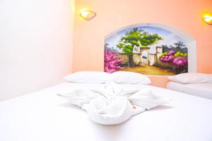 Cama ou camas em um quarto em Hotel Hacienda Cancun