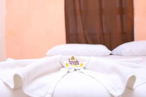 Cama ou camas em um quarto em Hotel Hacienda Cancun