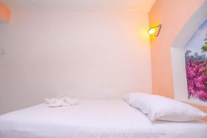 Cama ou camas em um quarto em Hotel Hacienda Cancun