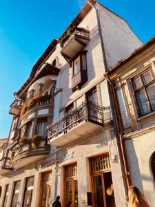 a building with balconies on the side of it at LittleParis in Cluj-Napoca