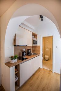 an archway in a kitchen with a counter top at Villa Beller New in Ičići