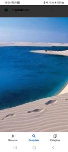 uma imagem de uma praia com o oceano e a areia em Camp Testar Branca Circuito Lagoa bonita em Barreirinhas
