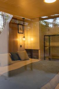 a living room with a couch and a window at Cabañas Rio Soñado in Valle Grande