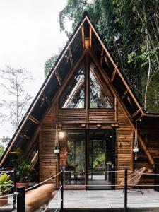 a cabin in the woods with a large window at Senz Glamping - Mindo in Mindo