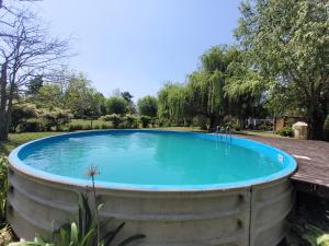 a large swimming pool in the middle of a park at Ensueño casa de isla in Tigre