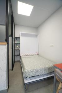Voodi või voodid majutusasutuse Aldabea I apartamento sostenible toas