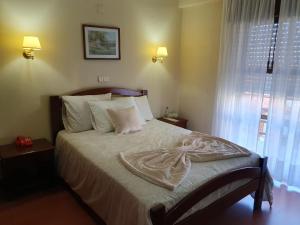 Postel nebo postele na pokoji v ubytování Hotel Peninsular