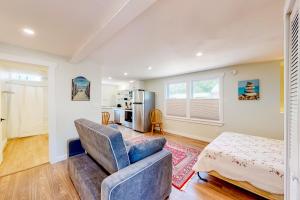 a living room with a couch and a kitchen at Shorelands 44-2 in Kennebunk