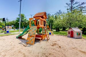 a playground with a slide and a play house at Shorelands 44-2 in Kennebunk